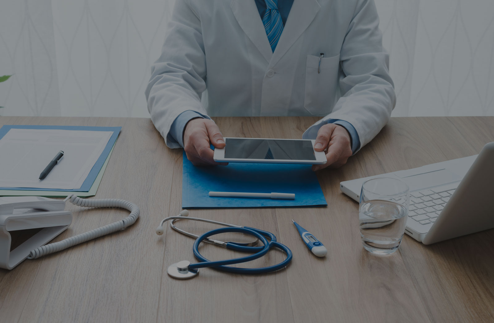 Doctor using digital tablet for prescriptions